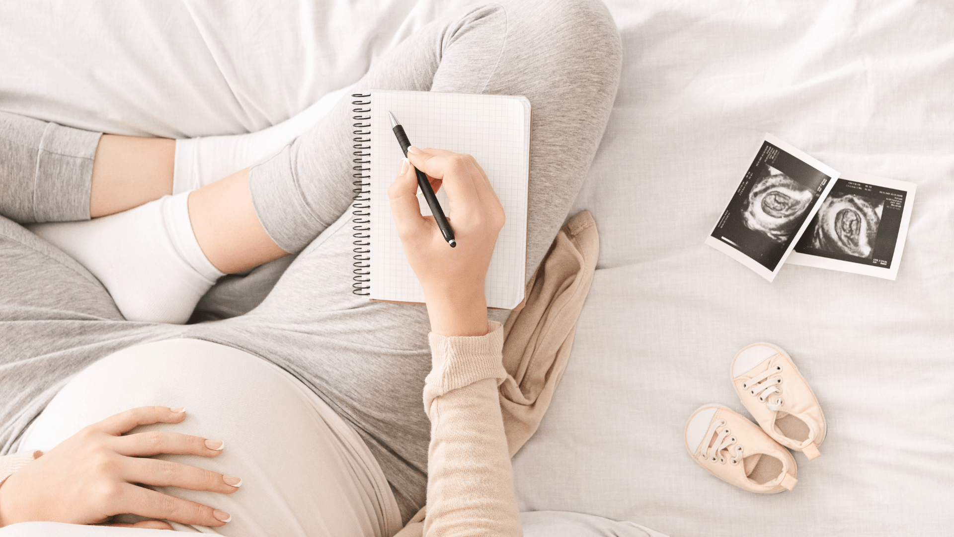 Pregnancy dairy. Pregnant woman writing